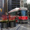 A streetcar stops on King Street in Toronto. A section of the busy east-west street travelling through downtown Toronto has restricted car traffic, and U of T Engineering researchers are collaborating with the City of Toronto and the Toronto Transit Commission to study the pilot project’s effects. (Credit: Billy Cabic via Flickr under creative commons license)