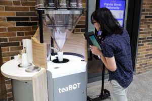 Sarah Lim (Year 3 MechE) inspects a teaBOT. (Photo: Tyler Irving)