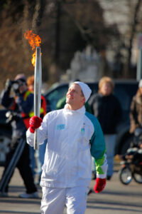Scott Butler carrying the Olympic torch. 