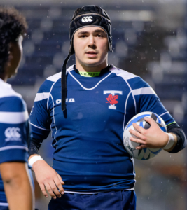 Christian Smith at Varsity Stadium during the 2021 season holding a rugby ball