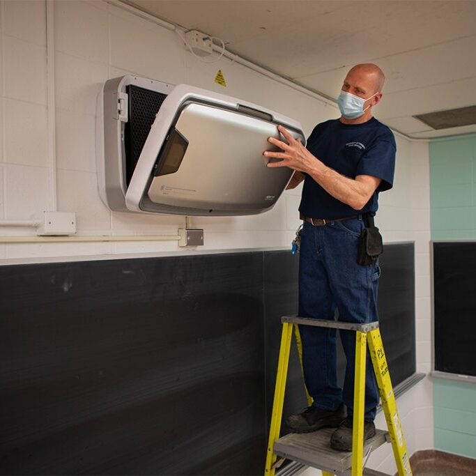March 24, 2021 - Paul Van Den Enden checks the operation of the HEPA air purifier in a classroom at Sidney Smith Hall. (Photo by Johnny Guatto)