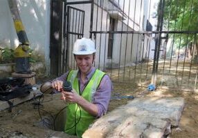 Professor David Taylor checking on his pressure, flow, and turbidity sensors in a valve chamber in Delhi, India. (Photo courtesy David Taylor)