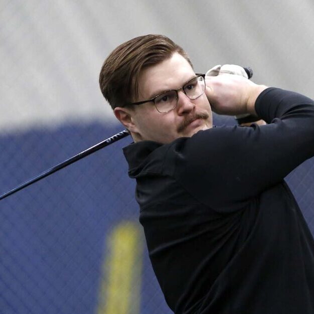 TORONTO, ONTARIO, CANADA; MARCH 14, 2022 — GOLFER— A photo of Brenden Lavoie (CivE 2T0 + PEY, MASc candidate) taking practice at the University of Toronto dome at Varsity Field in Toronto on Monday, March 14, 2022. Lavoie is a member of the Varsity Blue golf team and a PhD candidate in the Department of Civil &amp; Mineral Engineering. (Photo © Phill Snel, Department of Civil &amp; Mineral Engineering, University of Toronto)