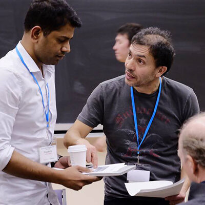 Recipe for success: coffee, and advice from Joseph Orozco, entrepreneur and executive director of The Entrepreneurship Hatchery (right). Twenty-three student teams worked to turn ideas into viable business plans at Hatchery Accelerator Weekend, Jan. 22 and 23 at the University of Toronto. (credit: Cherry Fan).