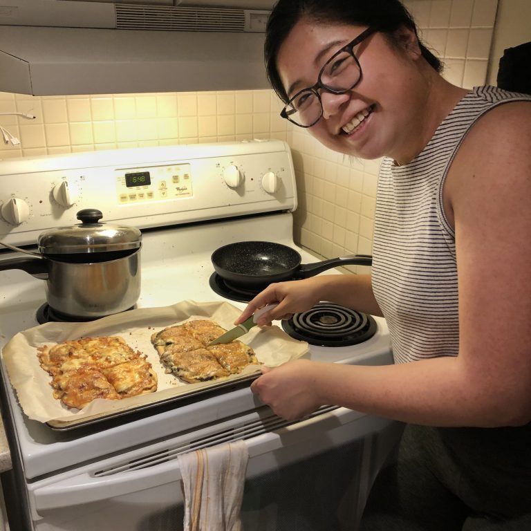 CivE MASc candidate Pia Dimayuga at home with homemade pizzas.