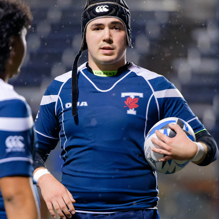 Christian Smith at Varsity Stadium during the 2021 season holding a rugby ball