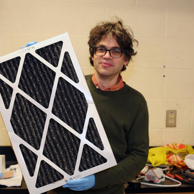 A file photo of Prof. Jeffrey Siegel with an air filter. 