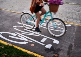 Toronto aims to have 75% of school/work trips under 5 kilometres walked, biked or by transit by 2030. Protected bike lanes have been shown to increase cycling. The question is: where should they go and how should we decide? (photo by anatoliy_gleb, via Envato Elements)